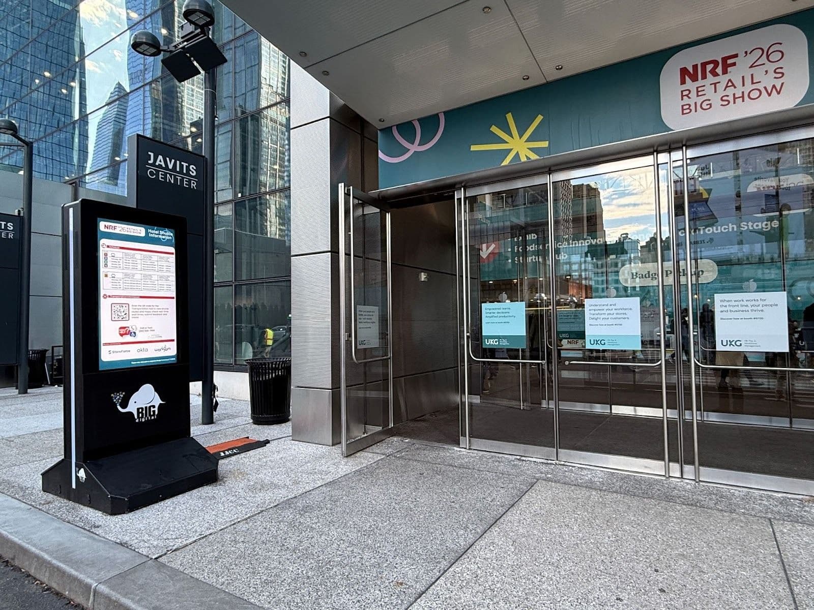 Eye-level outdoor portable digital billboard by BIG Digital welcoming attendees at the NRF 2026 Javits Center entrance.